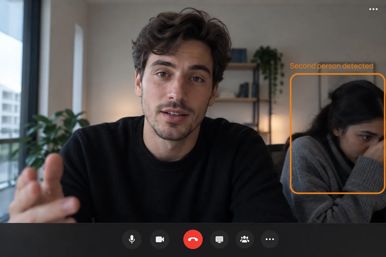 A candidate on a video call with the agent detecting a second person in the room.